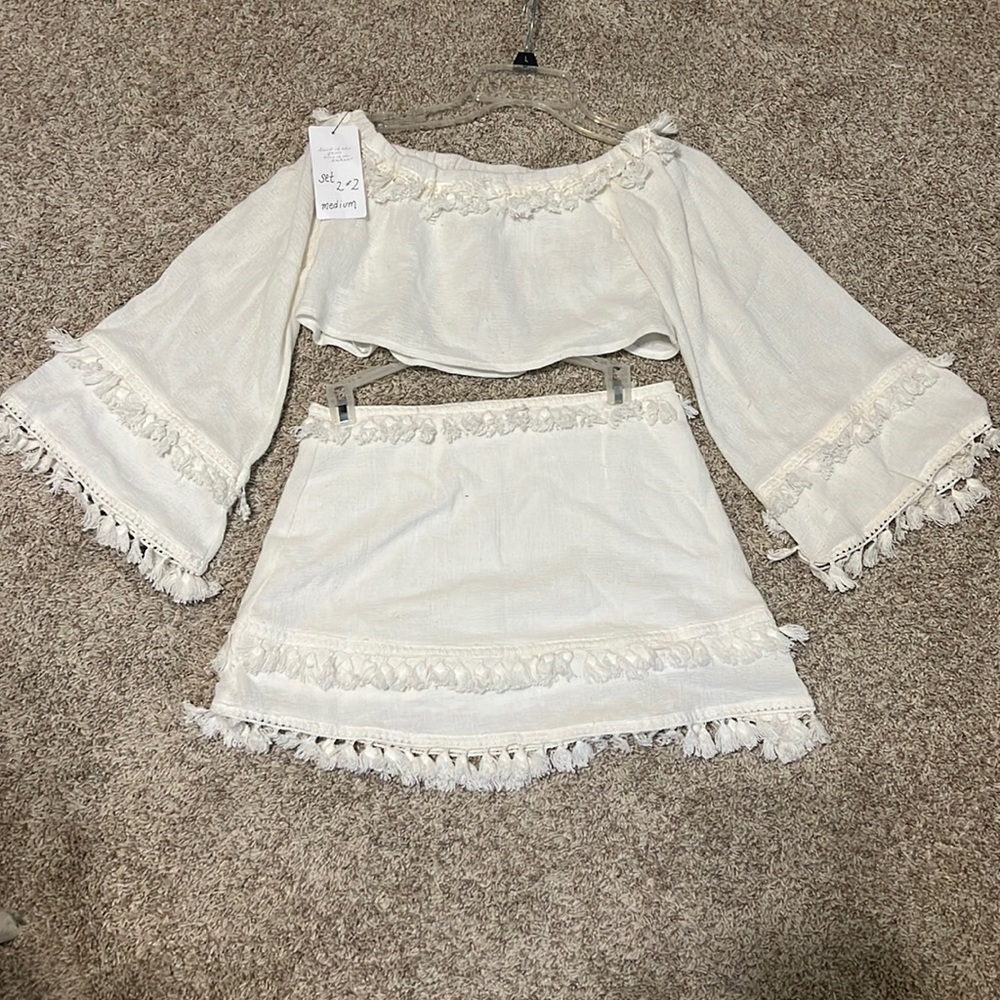 Cute skirt and cropped top set.  Flowy sleeves.  New, never worn